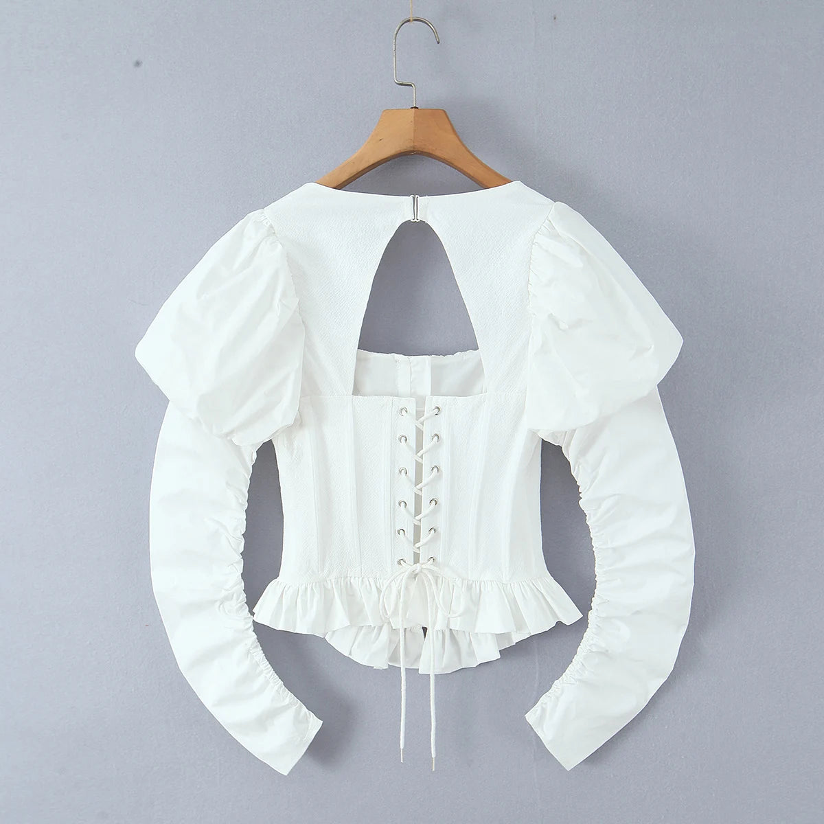 Back view of Backless Corset Crop Top, Adjustable Lace-Up Ties and Ruched Sleeves