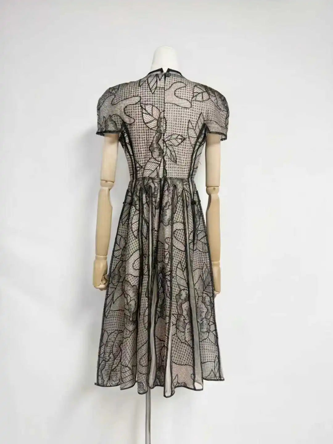 Back view of Sheer Lace Midi Dress, Invisible Zipper and Vertical Panel Details